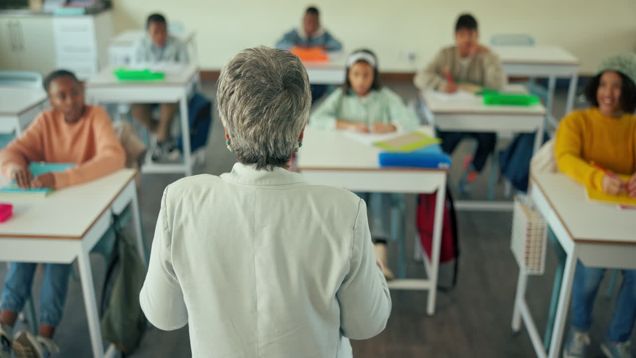 Teacher instructing a diverse group of students in a classroom