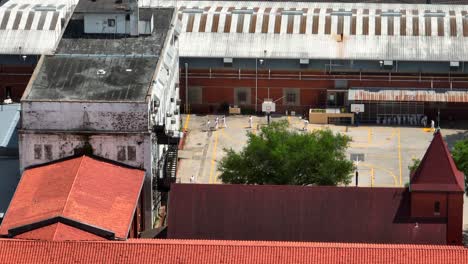 prison inmates in jumpsuit uniforms at jail