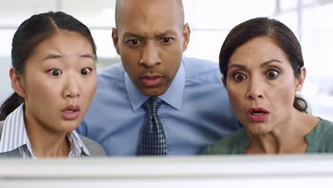 three coworkers express shock and awe during a captivating presentation in a modern office. their expressions reflect engagement and curiosity as they learn something unexpected.