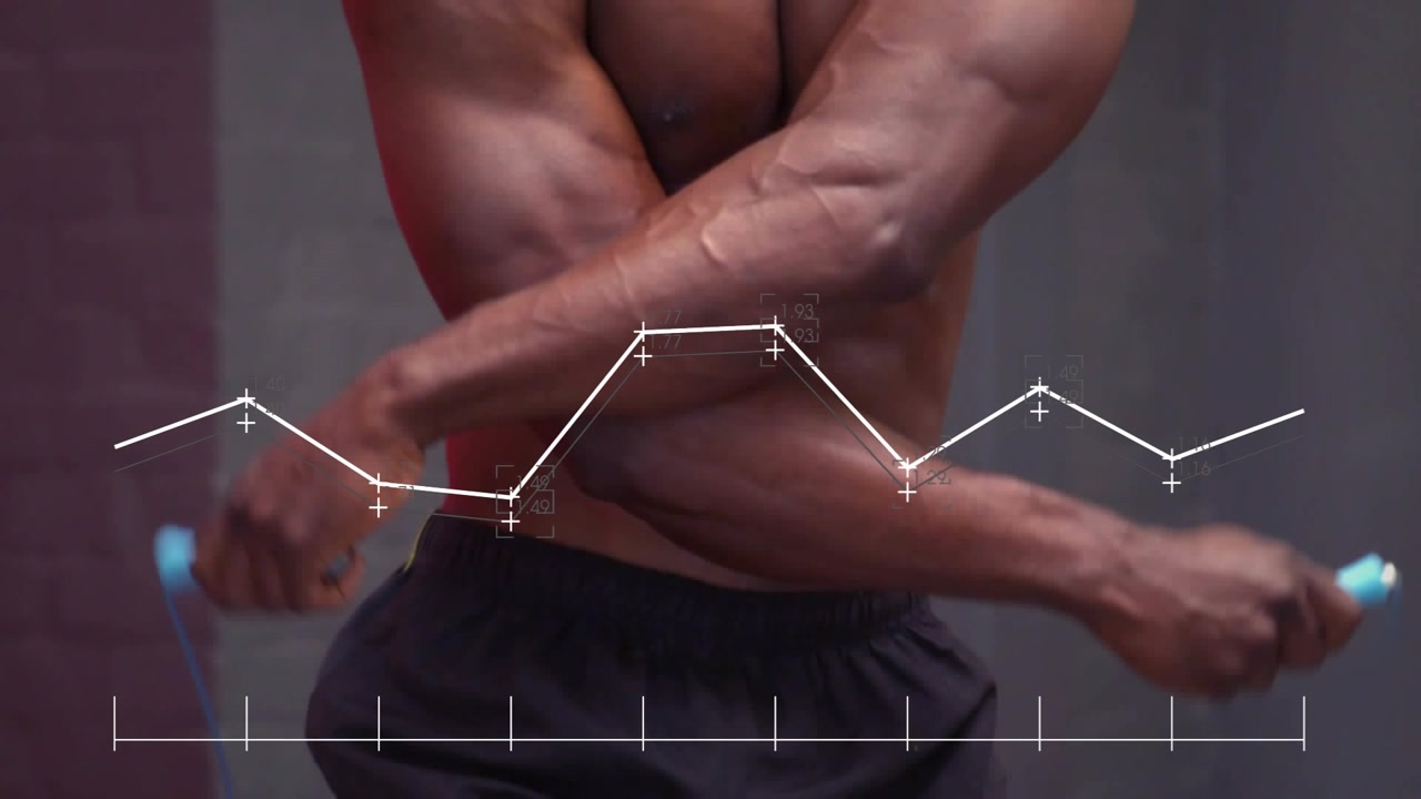 Athlete starting rope spin, jumping as camera panning, faint graph moving across torso for fitness