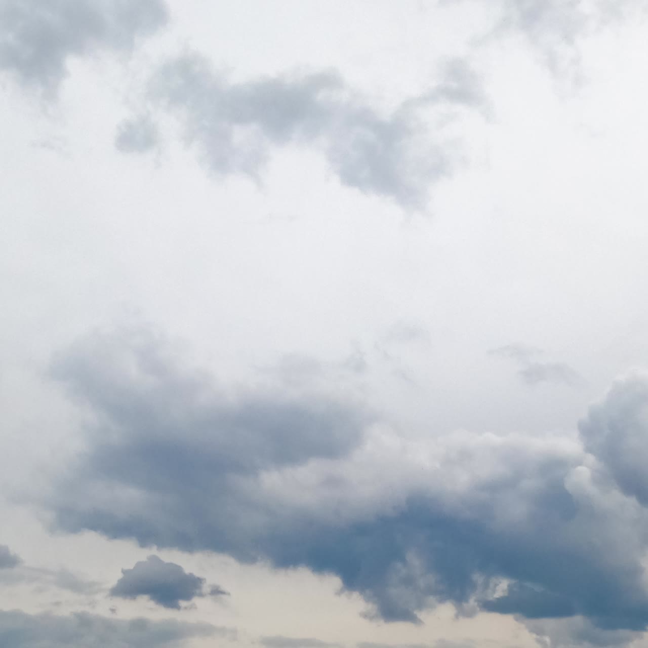 Overcast skies at daytime. Horizon fully covered with cloudscape. Low angle view. Timelapse