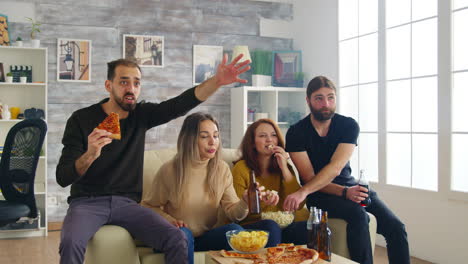 group of friends celebrating victory of football match