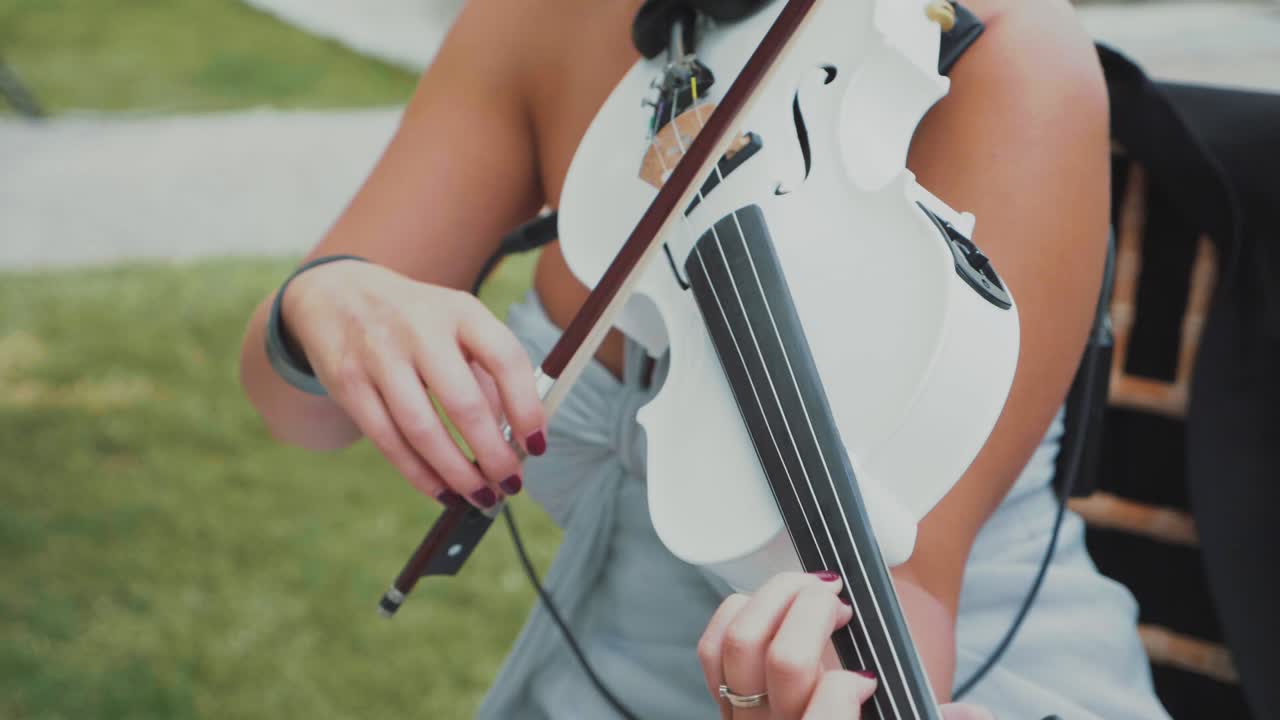 Woman violonist playing in slow motion