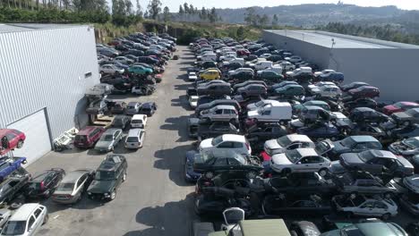 Aerial-view-of-a-junkyard-and-large-group-of-wrecked-cars