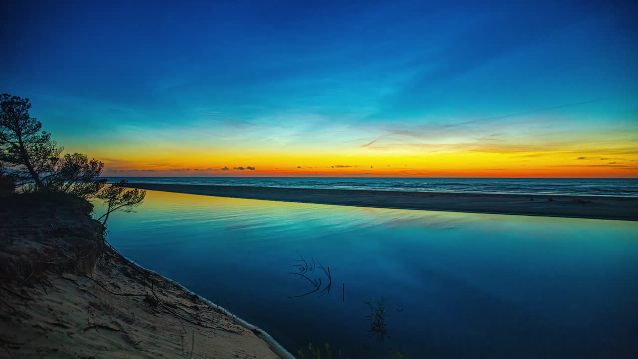Stunning Sunset over Calm Ocean Beach