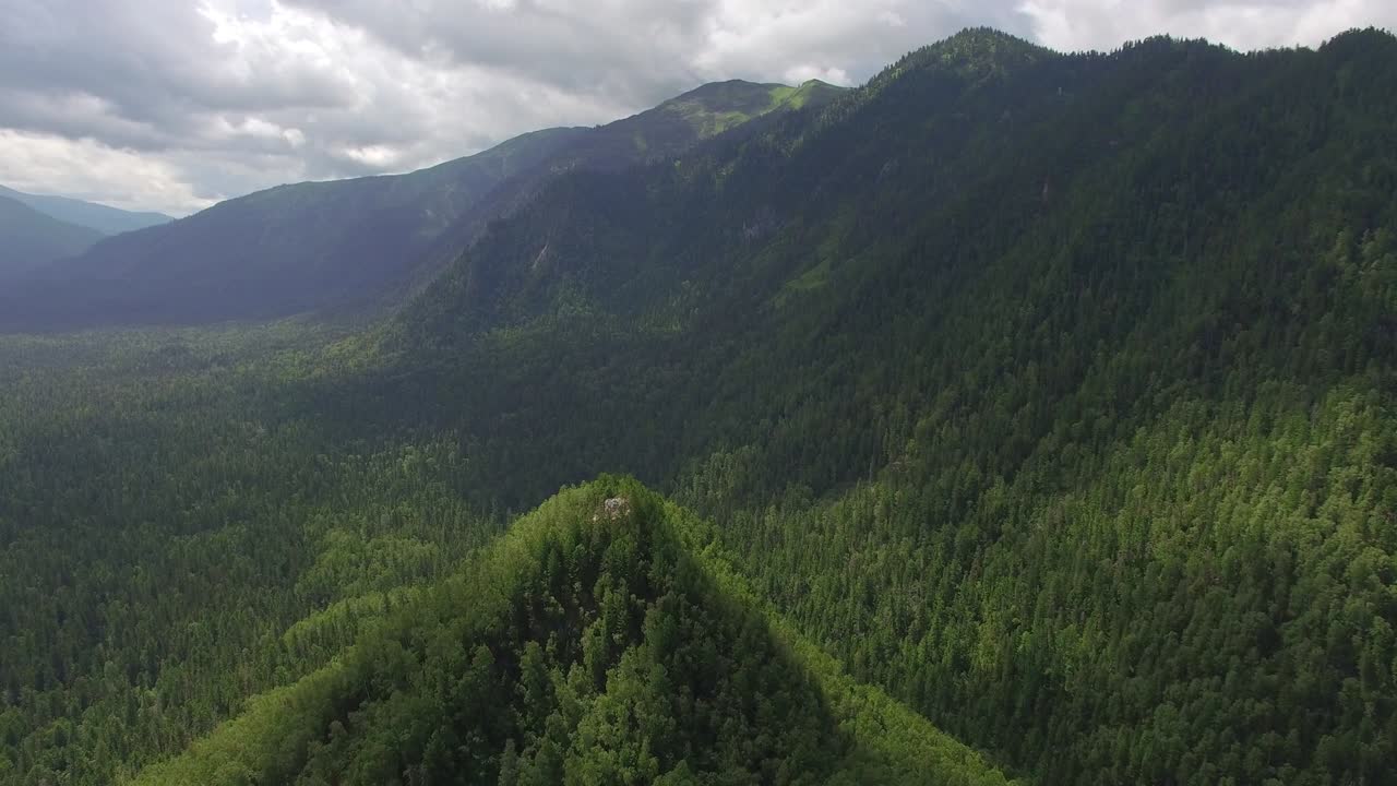 Aerial photography. Heavenly landscape of the landscape with a mountain lake in Siberia near Lake Baikal. Warm lake of the Snezhnaya River. Vydrino