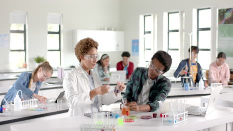 in high school laboratory, students conducting experiment with test tubes and beakers