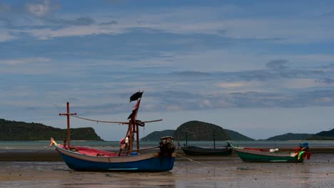 Fishing-Boats-mooring-in-low-tide-are-usually-seen-as-part-of-a-romantic-provincial-seascape-of-Khao-Sam-Roi-Yot-National-Park,-Prachuap-Khiri-Khan,-in-Thailand