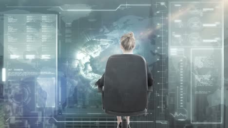 animation of digital interface over businesswomen sitting on chair