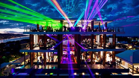 high-end rooftop nightclub with laser show