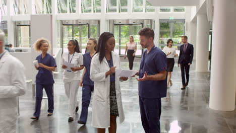 staff in busy lobby area of modern hospital shot on r3d