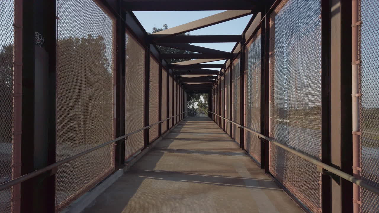 Covered footbridge above highway and canals