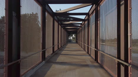 Covered-footbridge-above-highway-and-canals