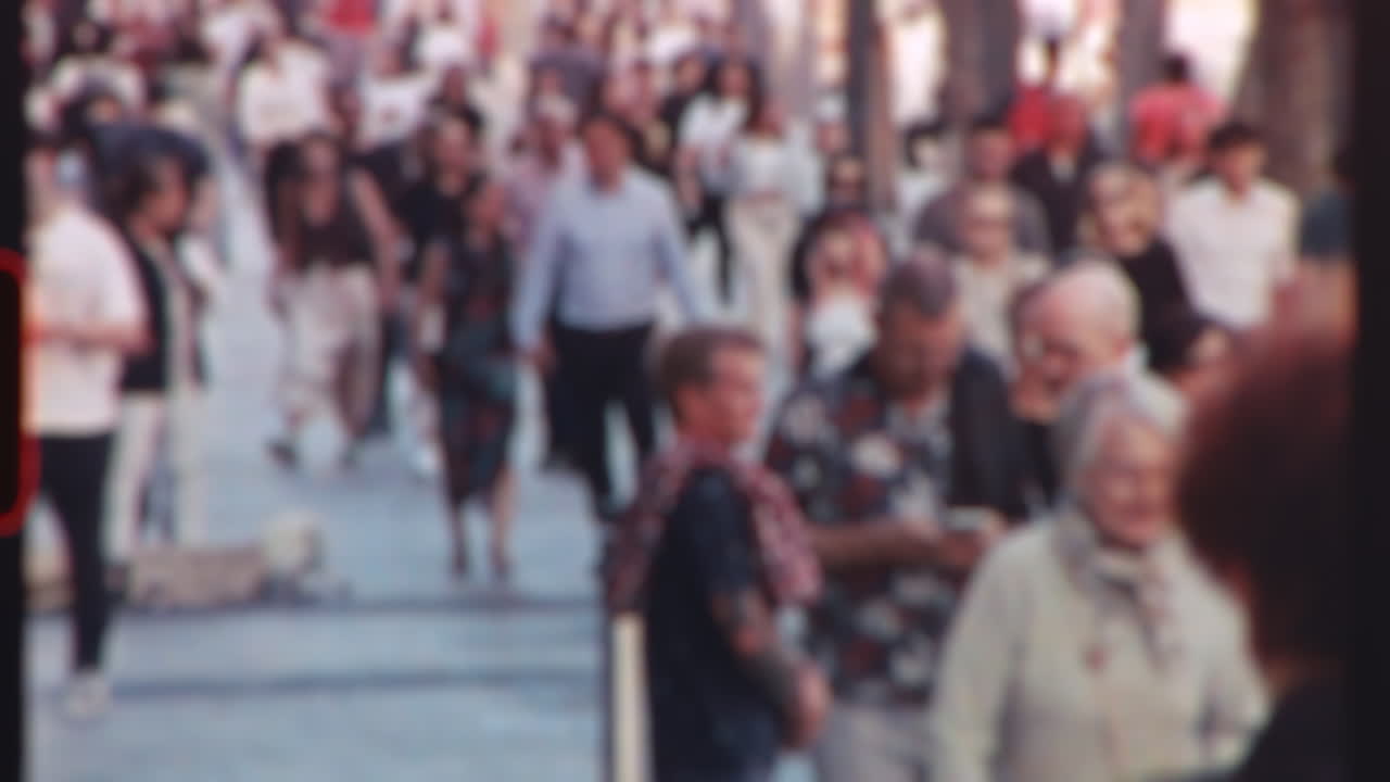 Timelapse of pedestrians and tourists casually strolling along vibrant street during sunny summer day, capturing urban lifestyle and local energy modern city