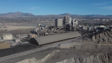 flying along a huge cement plant and quarry