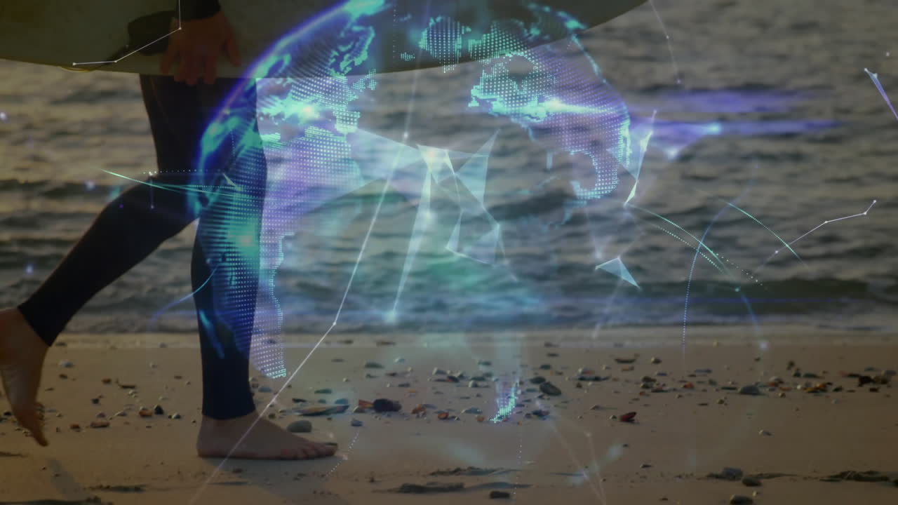 Mid adult man walking barefoot along beach holding surfboard with glowing tech holographic globe