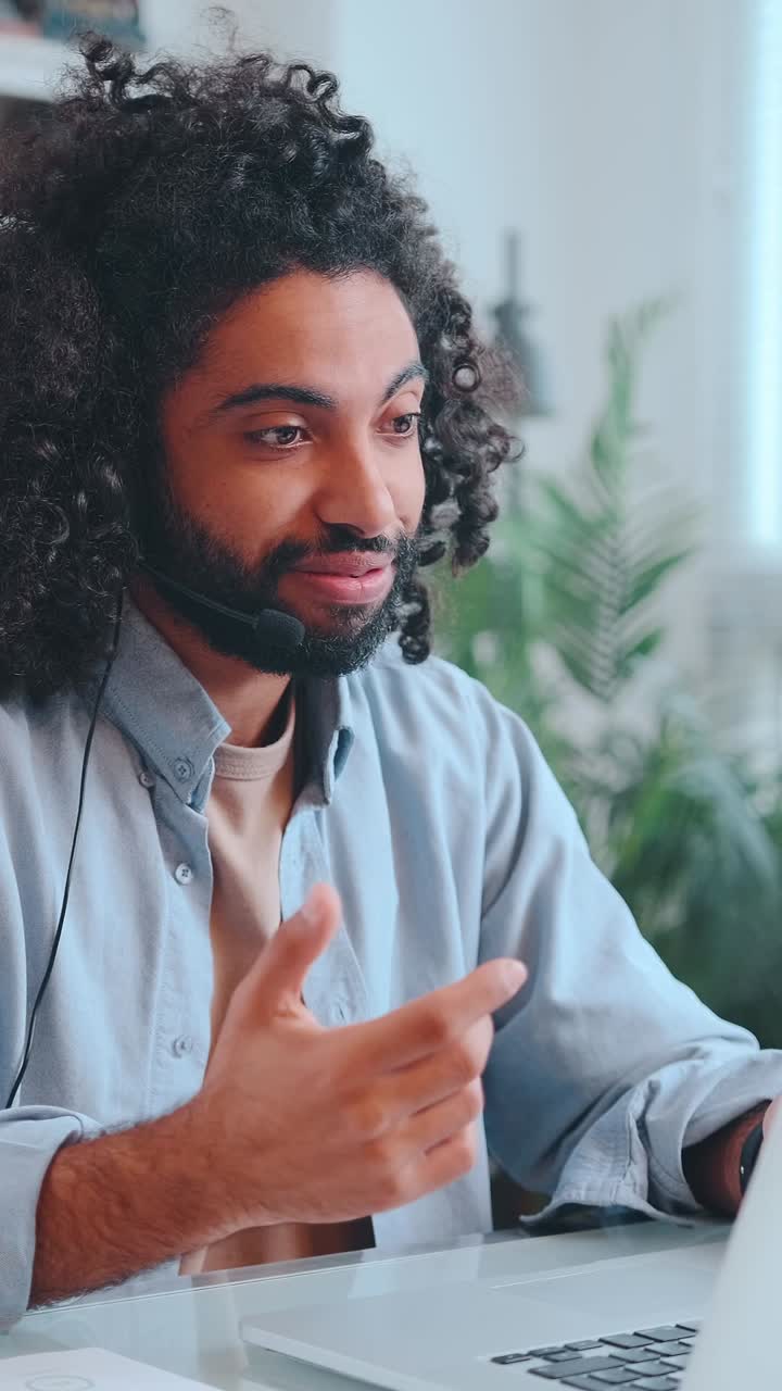 Young arabian business man uses headset with microphone to record podcast
