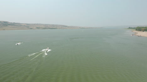 Wide-Aerial-Panorama,-Speed-Boat-Sailing-On-Lake-Diefenbaker,-Saskatchewan-Landing,-Canada