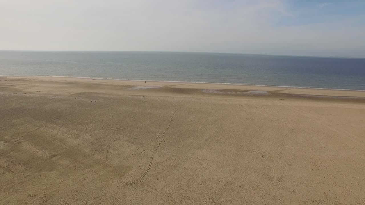 Aerial view of a sandy beach and the sea