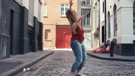 Contemporary-funky-caucasian-woman-street-dancer-dancing-freestyle-in-the-city