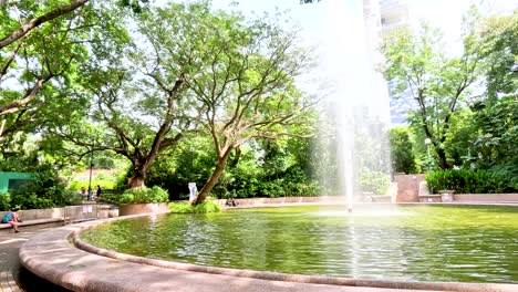 park fountain and people relaxing