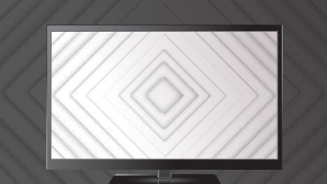 formas de diamante blanco que se mueven en el monitor de televisión sobre formas de diamante blanco