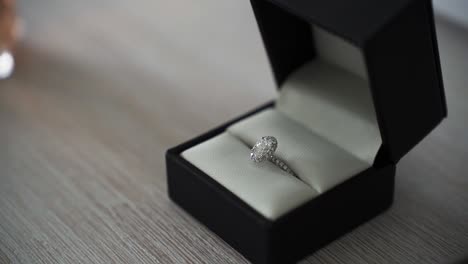 Box-With-Engagement-Ring-On-Table---close-up