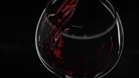 red wine pouring into glass