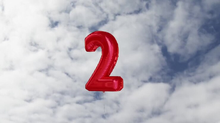 Animazione di un palloncino rosso numero uno sul cielo sullo sfondo