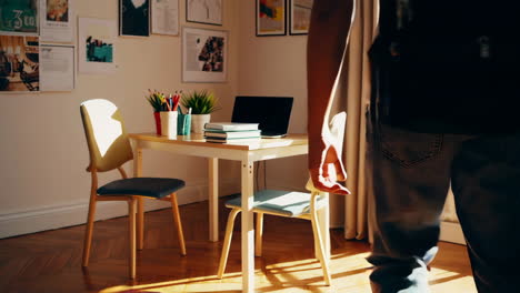 student walking with backpack to study room