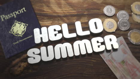 Hello-Summer-with-travel-passport-and-money-on-wood