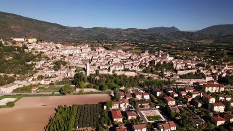 aerial tilt up reveal of small medieval town spello in umbria, italy