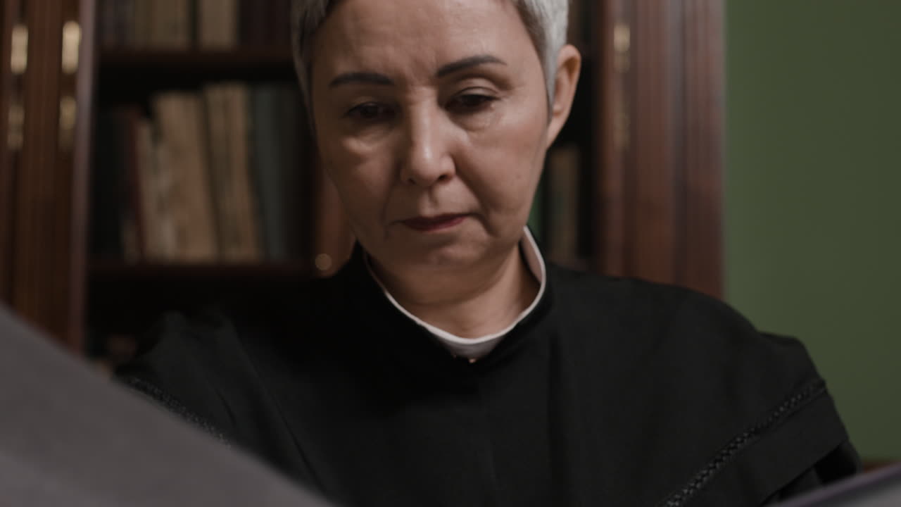 Lawyer reviewing documents in a library setting