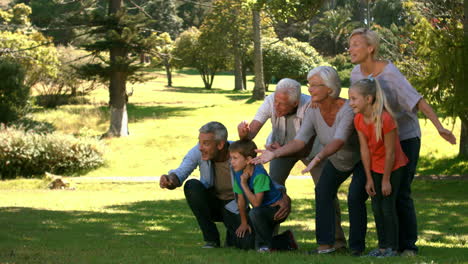 happy family with their dog in park