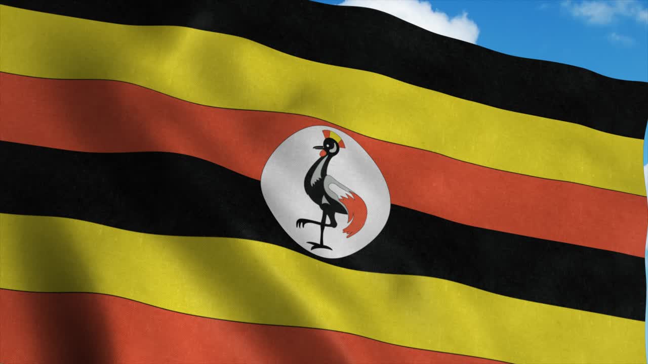 Bandiera dell'Uganda che sventola al vento, sfondo cielo blu. 4K