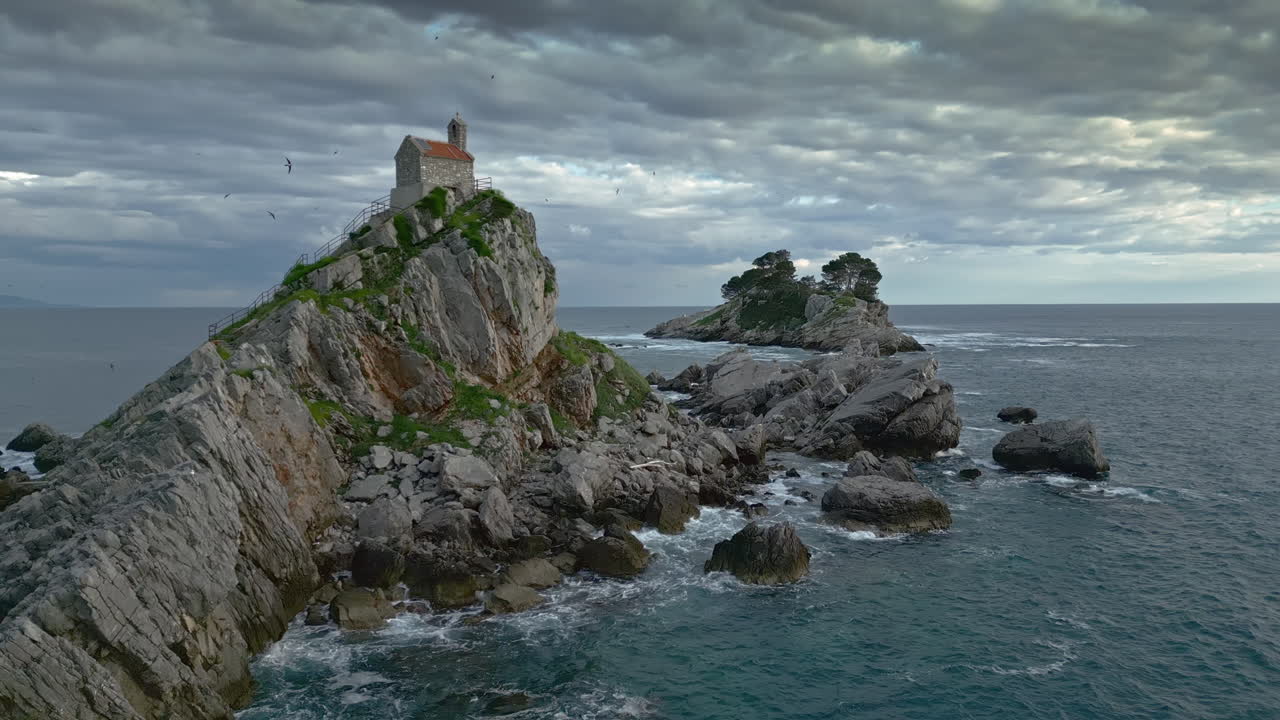 Picturesque Island with Church on Rocky Coast