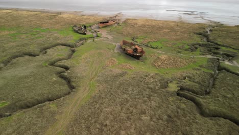 Rusted-shipwreck-approach-on-salt-marsh-at-Fleetwood-Marshes-Nature-Reserve