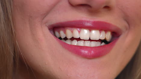 Closeup-on-beautiful-white-smile-of-young-woman