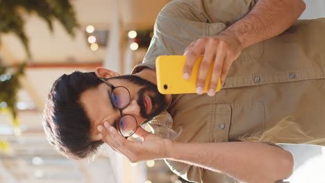 surprised young adult man use smartphone loses bad news fortune loss fail outdoors in city street
