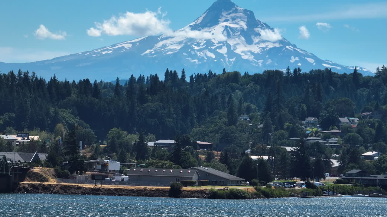 Aerial view of the riverfront of the Hood river with snowy mountain background