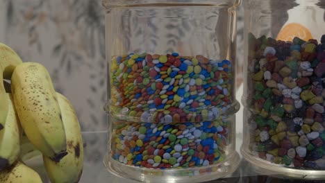 colorful candies in glass jars