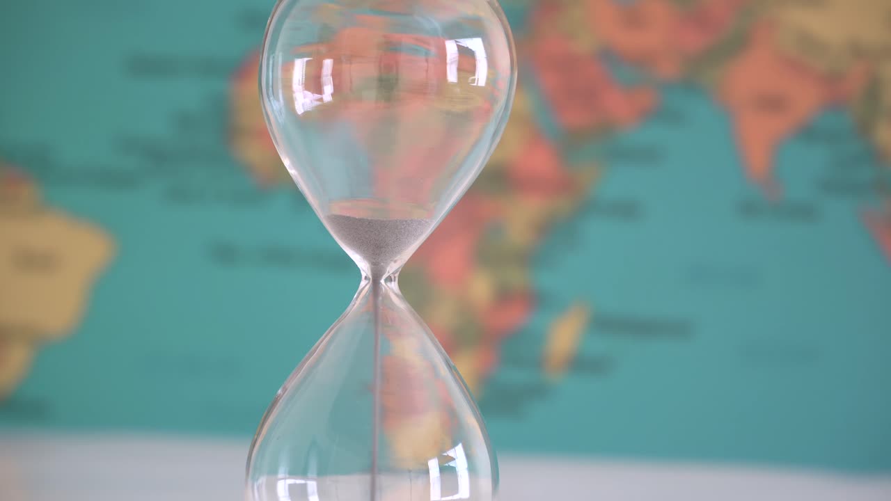 Time running out for climate change and other destructive forces as depicted with the hour glass.