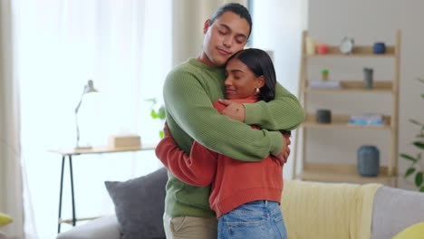 Love,-couple-hug-and-together-in-living-room