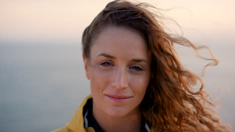 woman with curly hair at sunset