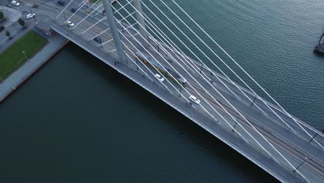 aerial: cars, street tram cross cable stayed crusell bridge, helsinki