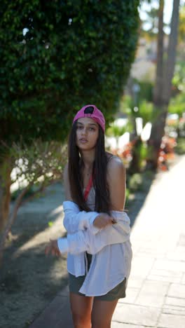 teenager posing outdoors in a park