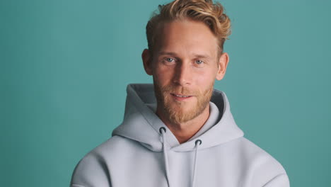 Happy man smiling in sweatshirt