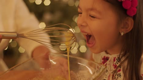 mother and daughter preparing for christmas celebration