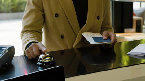 african american man waiting at the entrance of a hotel