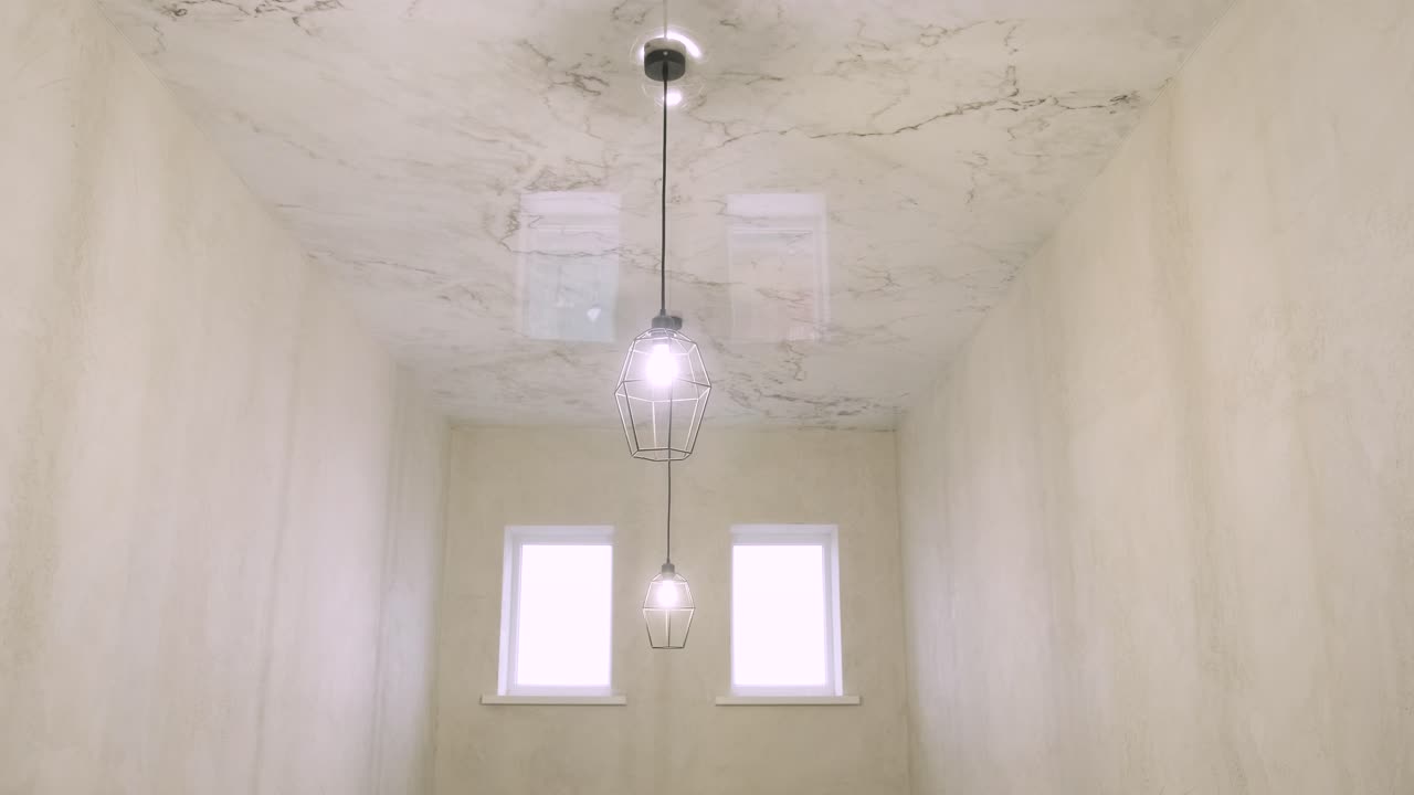 Installation of stretch ceilings with a print repeating marble